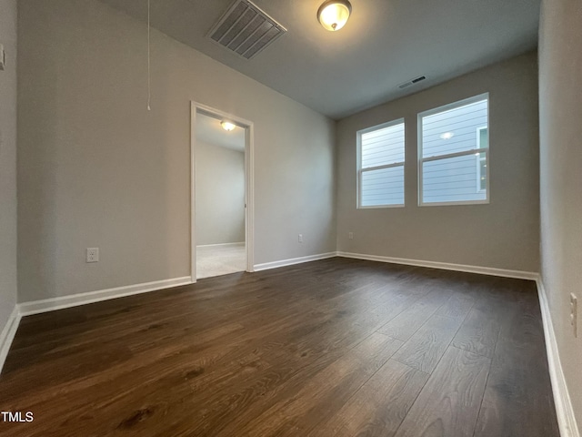 321 Murray Grey Ln, Wake Forest, NC 27587 - empty room featuring dark wood finished floors, baseboards, and attic access