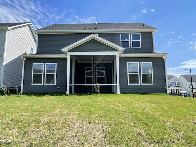 321 Murray Grey Ln, Wake Forest, NC 27587 - rear view of house with a sunroom and a lawn