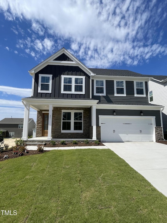 321 Murray Grey Ln, Wake Forest, NC 27587 - craftsman house featuring stone siding, an attached garage, driveway, and board and batten siding