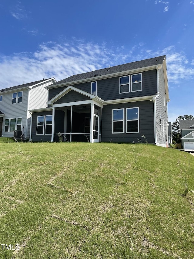 321 Murray Grey Ln, Wake Forest, NC 27587 - back of property featuring a sunroom, a lawn, and central AC unit