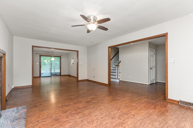 empty room with ceiling fan and dark hardwood / wood-style floors