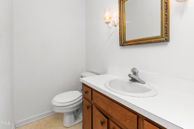 bathroom with tile patterned floors, toilet, and vanity