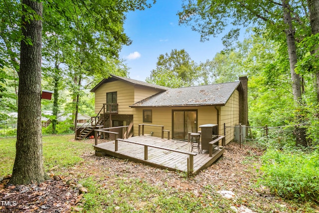 back of house with a wooden deck