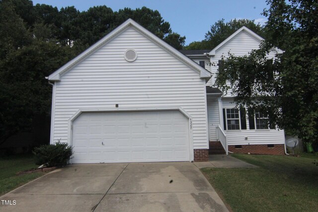 exterior space featuring a garage and a front lawn