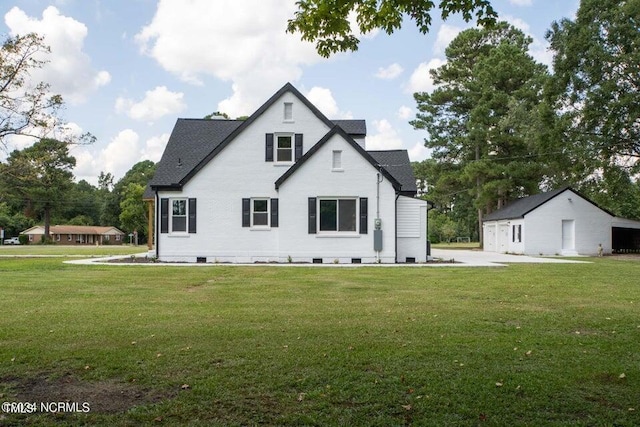 back of property featuring a yard and crawl space