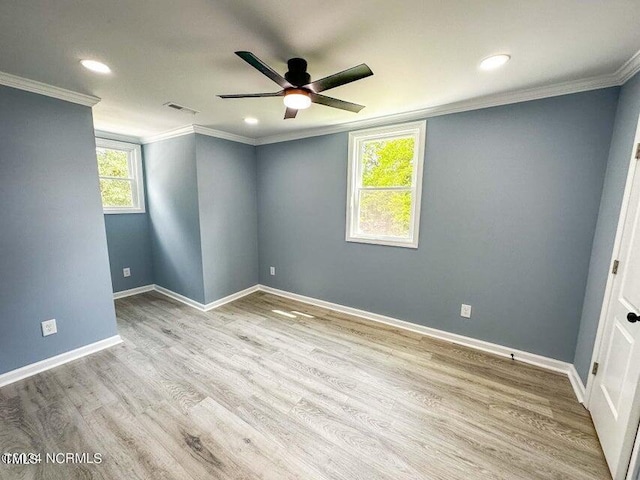 unfurnished room featuring crown molding, ceiling fan, a healthy amount of sunlight, and light hardwood / wood-style floors