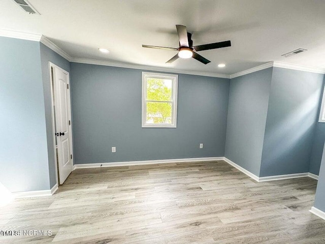 spare room with light wood-type flooring, crown molding, and ceiling fan