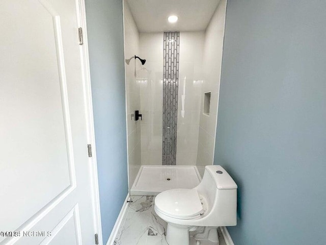 full bathroom with a shower stall, toilet, baseboards, and marble finish floor