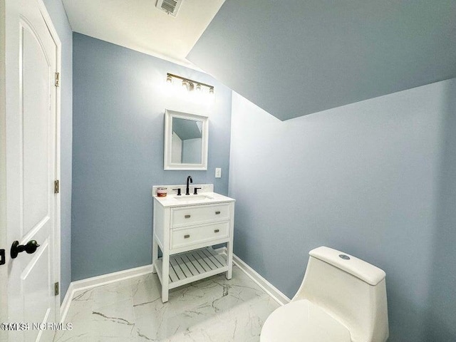 bathroom featuring visible vents, toilet, baseboards, and marble finish floor