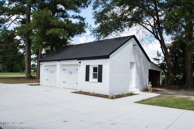 view of property exterior featuring a garage