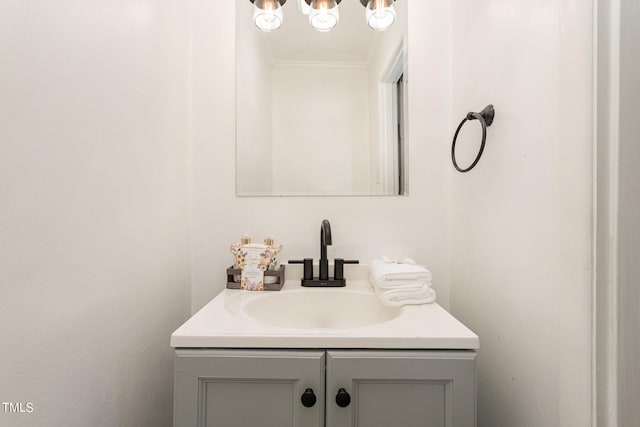 bathroom with vanity and crown molding