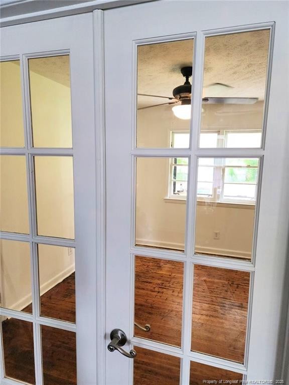 doorway featuring french doors and ceiling fan