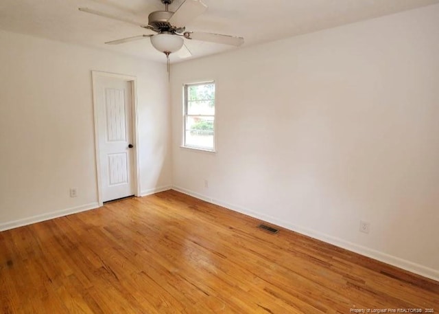 unfurnished room with ceiling fan and light hardwood / wood-style floors