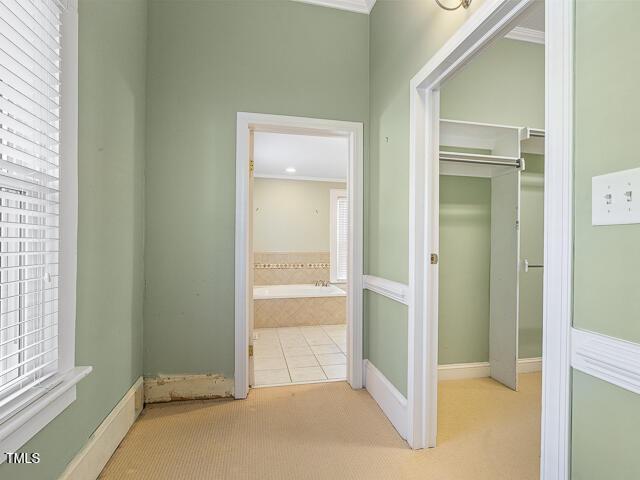 715 E Broad St, Fuquay Varina, NC 27526 - hallway featuring carpet and baseboards