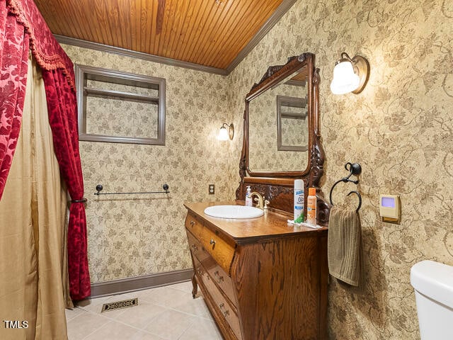 bathroom with vanity, wood ceiling, crown molding, tile patterned floors, and toilet