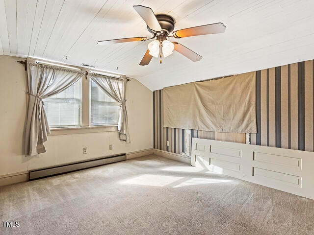 carpeted spare room with a baseboard radiator, lofted ceiling, ceiling fan, and wooden ceiling