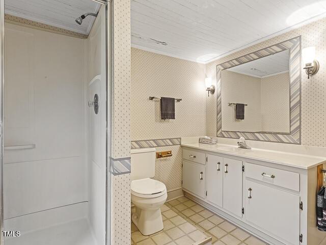 715 E Broad St, Fuquay Varina, NC 27526 - bathroom with wallpapered walls, a shower, toilet, vanity, and crown molding