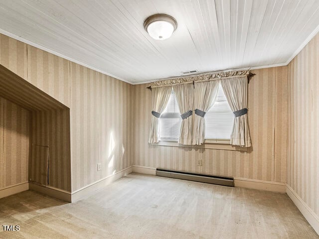 unfurnished room featuring carpet, wooden ceiling, and a baseboard heating unit