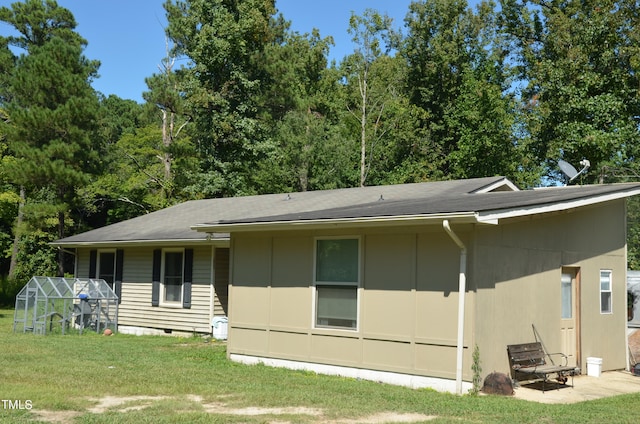 back of house with a yard