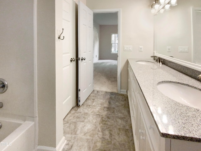 bathroom with a tub to relax in and vanity