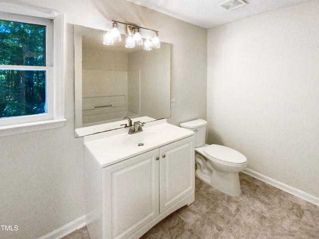 bathroom with vanity and toilet