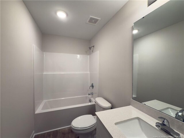 4992 Blue Springs Rd, Red Springs, NC 28377 - bathroom featuring visible vents, toilet, bathtub / shower combination, wood finished floors, and vanity