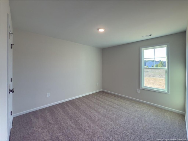 4992 Blue Springs Rd, Red Springs, NC 28377 - carpeted spare room featuring baseboards and visible vents