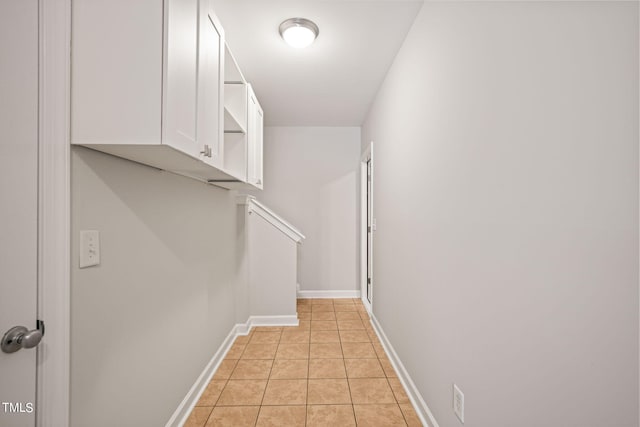 corridor featuring light tile patterned floors