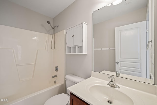 full bathroom featuring tub / shower combination, vanity, and toilet