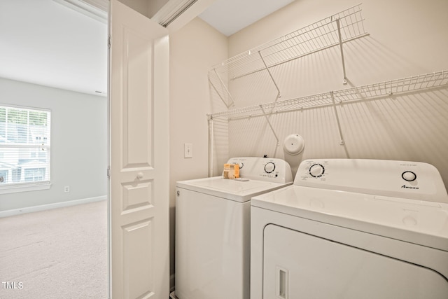 laundry area featuring carpet flooring and separate washer and dryer