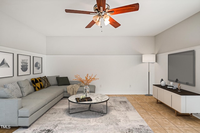 living room with ceiling fan and light tile patterned floors