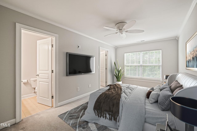 bedroom featuring light carpet, crown molding, ceiling fan, and connected bathroom