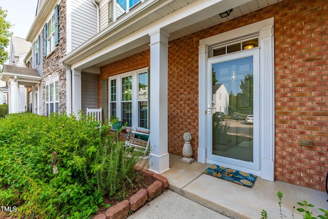 doorway to property featuring a porch