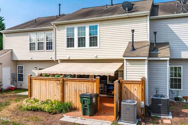 rear view of property with central air condition unit