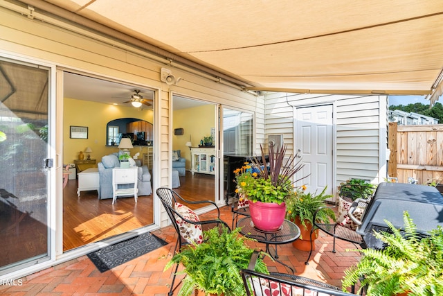 view of patio / terrace featuring ceiling fan