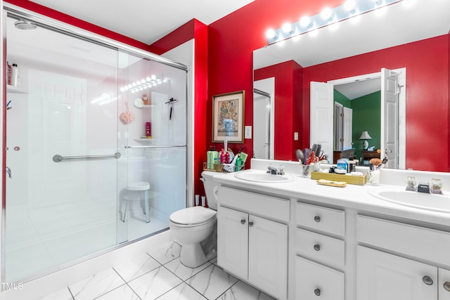 bathroom with vanity, toilet, and an enclosed shower