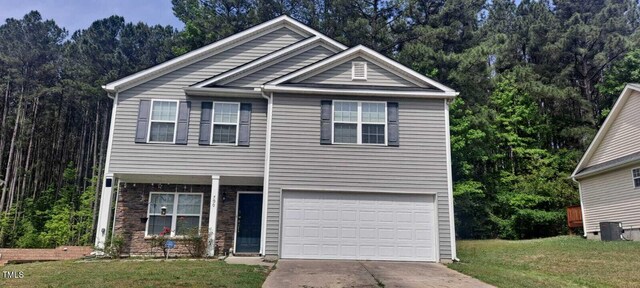 view of front of home featuring a garage and a front yard