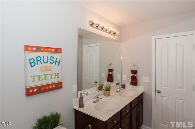 bathroom with double vanity and a sink