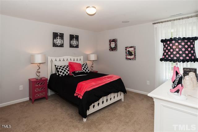 bedroom with light colored carpet