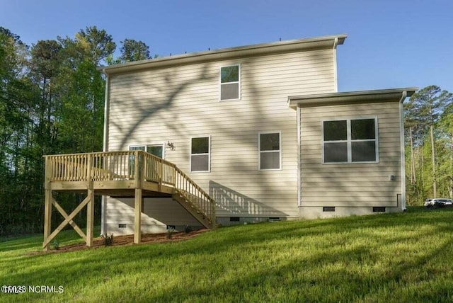 back of house with a yard and a wooden deck