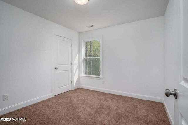 spare room with carpet