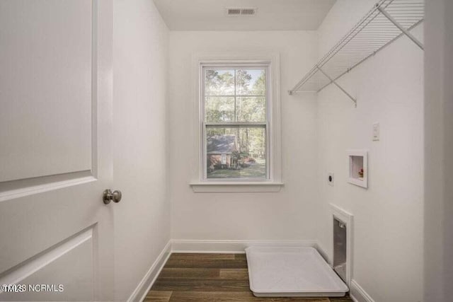 laundry room with hookup for a washing machine, dark wood-type flooring, and hookup for an electric dryer