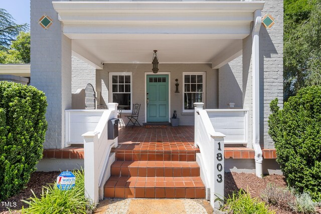 doorway to property with a porch