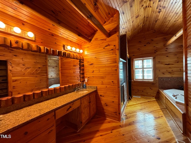 bathroom featuring vanity, lofted ceiling, wooden walls, hardwood / wood-style flooring, and wooden ceiling