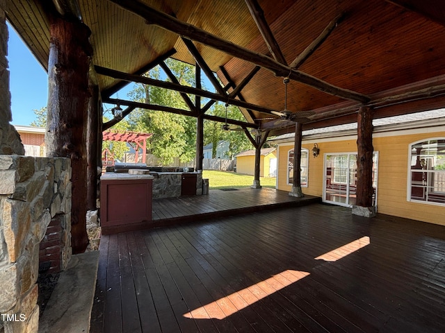 wooden deck featuring ceiling fan