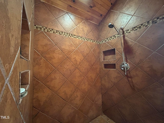 bathroom with a tile shower