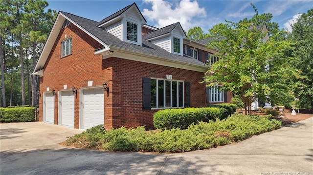 view of property exterior featuring a garage