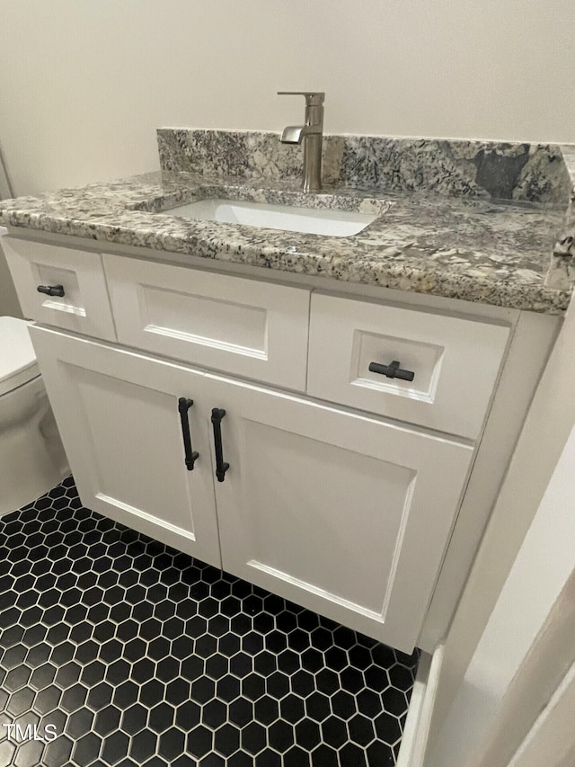 bathroom with vanity and toilet