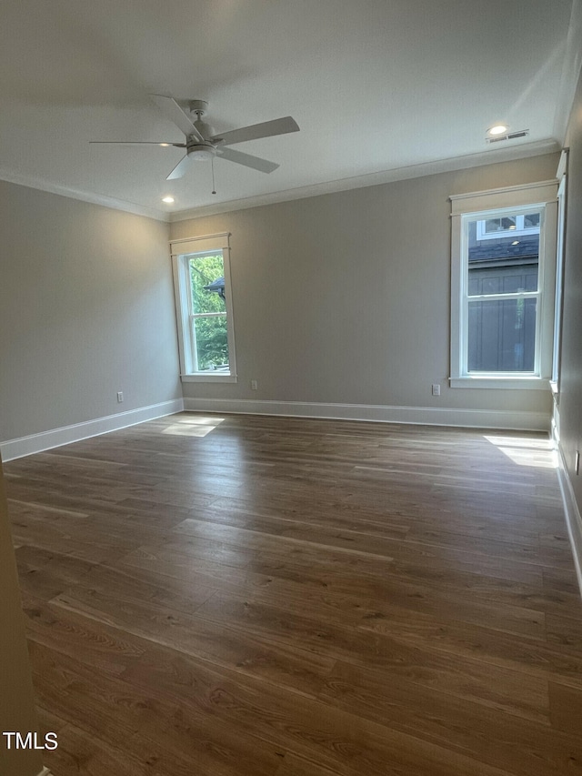 spare room with crown molding, ceiling fan, and dark hardwood / wood-style flooring