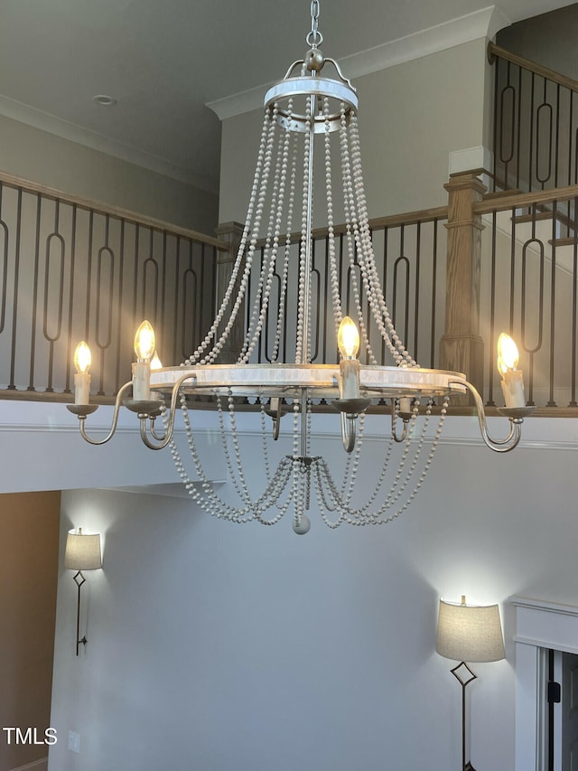 details featuring ornamental molding and a notable chandelier